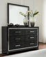 Kaydell Queen Upholstered Panel Headboard with Mirrored Dresser, Chest and 2 Nightstands