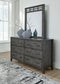 Montillan King Panel Bed with Mirrored Dresser, Chest and 2 Nightstands